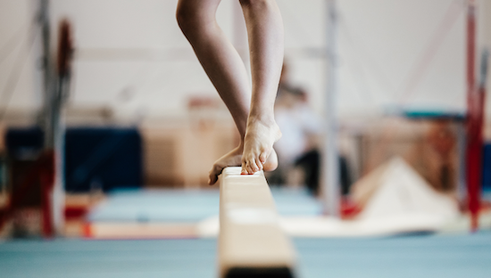 Gymnast feet on a balance beam