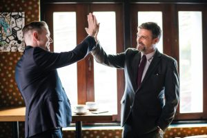 Two business men high-fiving